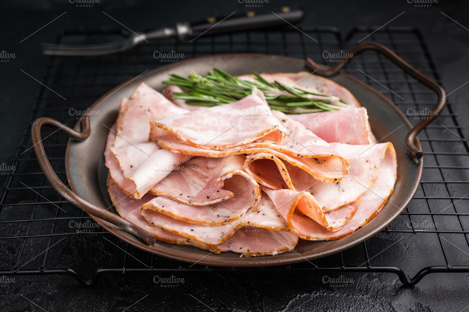 Slices of Italian Pancetta Arrotolata with rosemary in a metal d, a Food & Drink Photo by composter-box@mail.ru