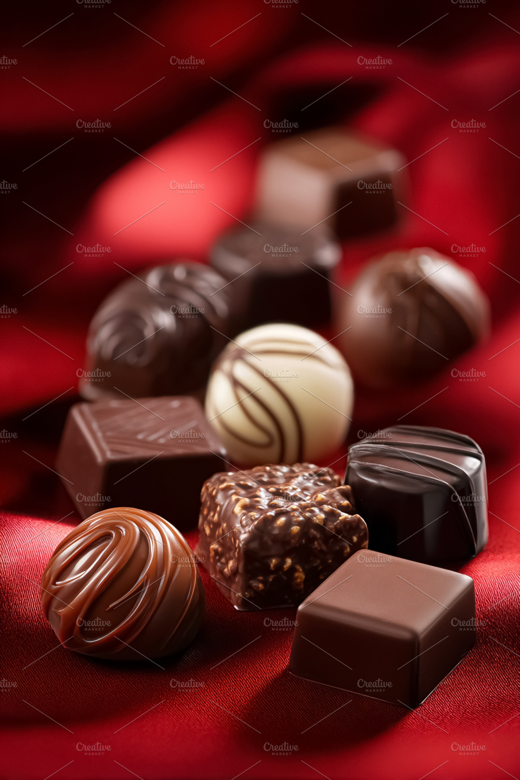 Assortment of gourmet chocolate truffles and bonbons arranging o, a Photo by Studio ANNA