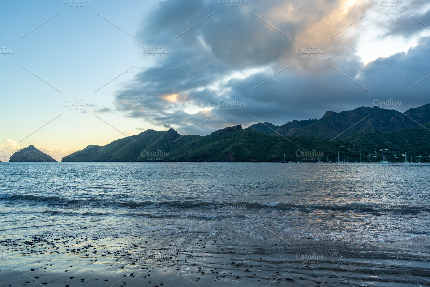 Taiohae Bay at sunset with sailboats in Nuku Hiva, Marquesas Isl, a Photo by GoodGoods