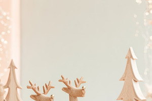 Christmas wooden reindeer in snowy winter scene with copy space