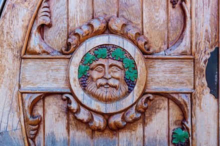round wooden door to the wine cellar, an Abstract Photo by Photostock