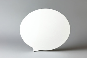 Speech bubble on a pastel grey background for creative communication ideas, a Background Photo by AlyaAnd