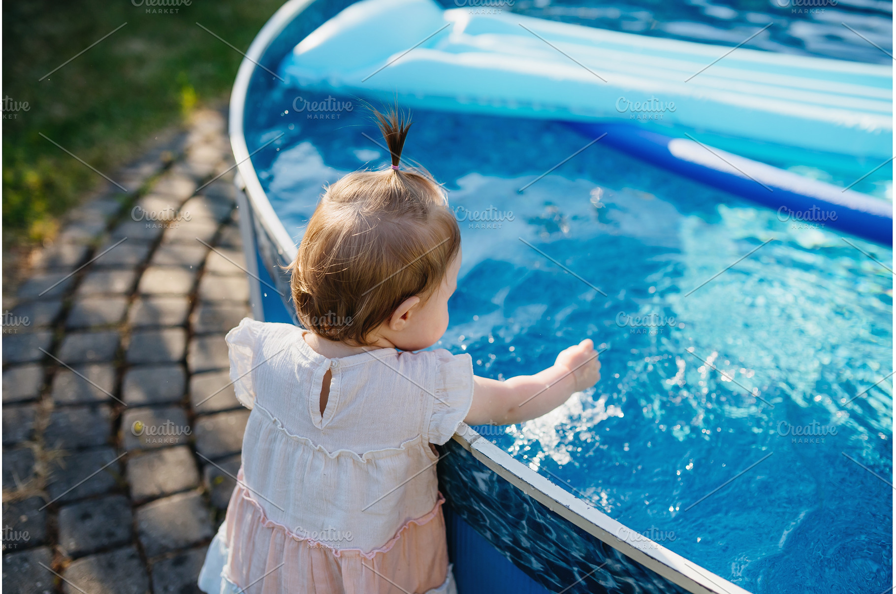 Little girl splashing water in, a Nature Photo by HalfPoint