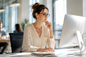 Woman works at computer in office, a Photo by Beautiful things