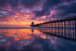 Stunning ocean pier sunset vibrant c, a Photo by Pixeness Studio