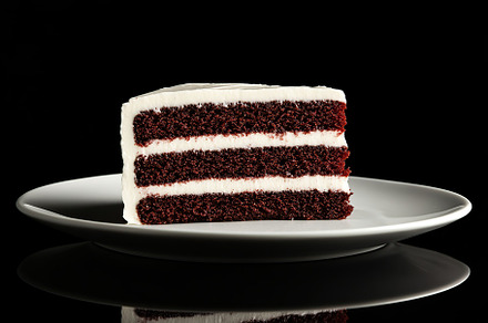Delicious piece of cake with frosting cream, a Food & Drink Photo by AlyaAnd