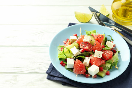 Concept of tasty food, salad with red orange, space for text, a Food & Drink Photo by AtlasStudio