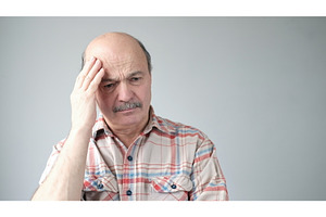 Senior caucasian man showing how