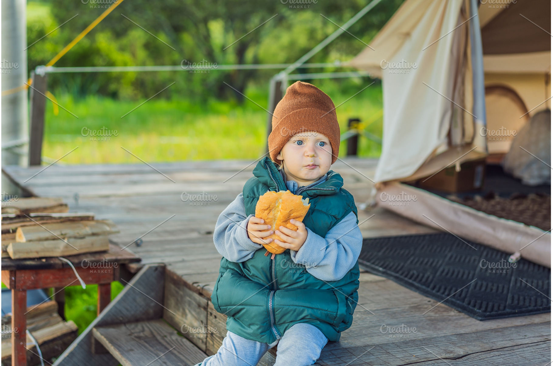 Young toddler tourist in a warm vest, a Holiday Photo by Elizaveta Galitskaya