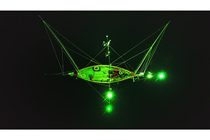 Squid fishing boat illuminating the, a Transportation Photo by Goinyk