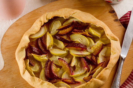 Homemade apple and plum galette table for teatime, a Food & Drink Photo by vimart