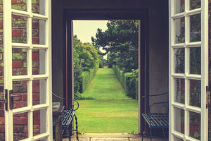 English garden featuring doors, open, and garden