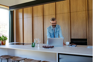 Man working from home office, a Person Photo by HalfPoint