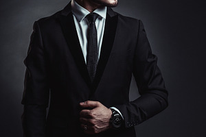Stylish man in studio containing fashion, man, and suit