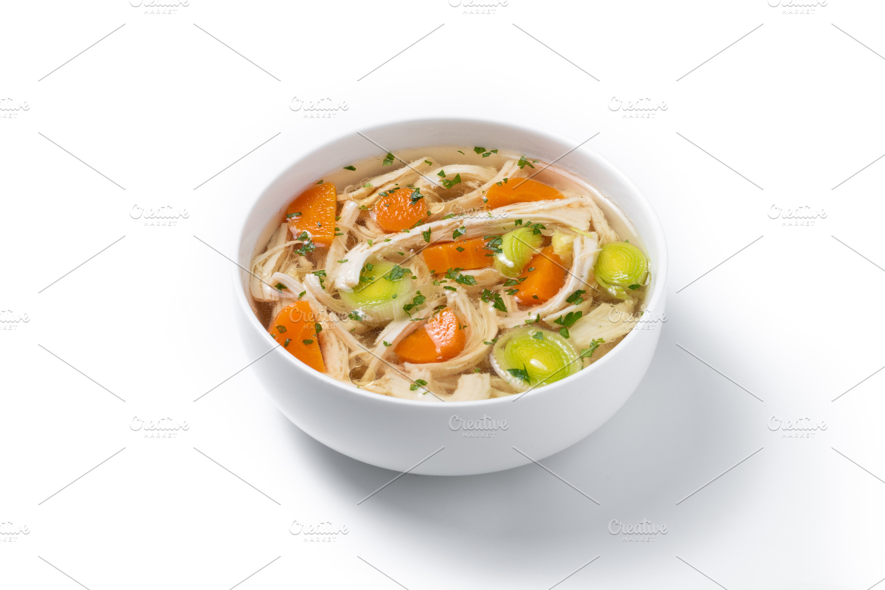 Homemade chicken soup in white bowl with carrots and celery, a Food & Drink Photo by etorres69