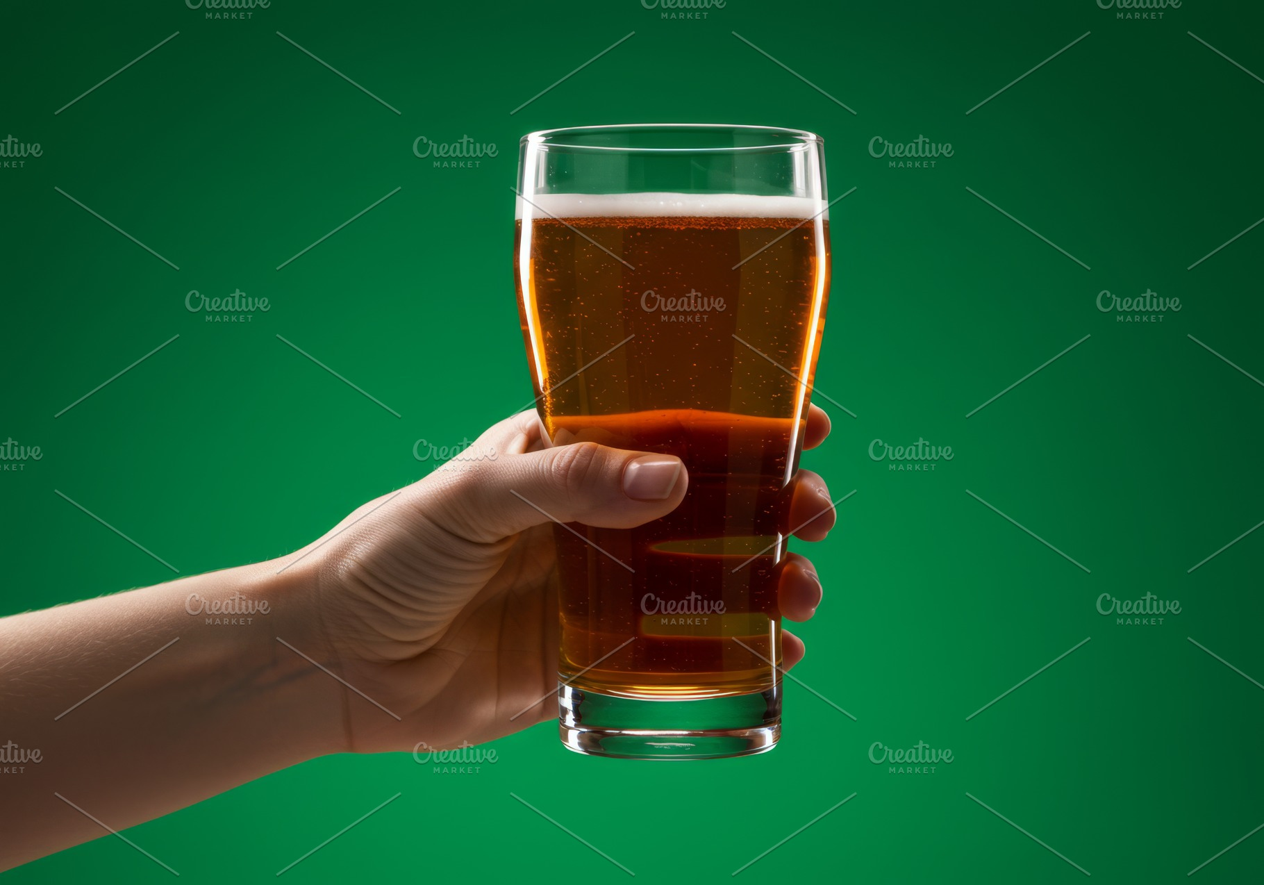 Hand holding a pint of beer against, a Food & Drink Photo by professorinc