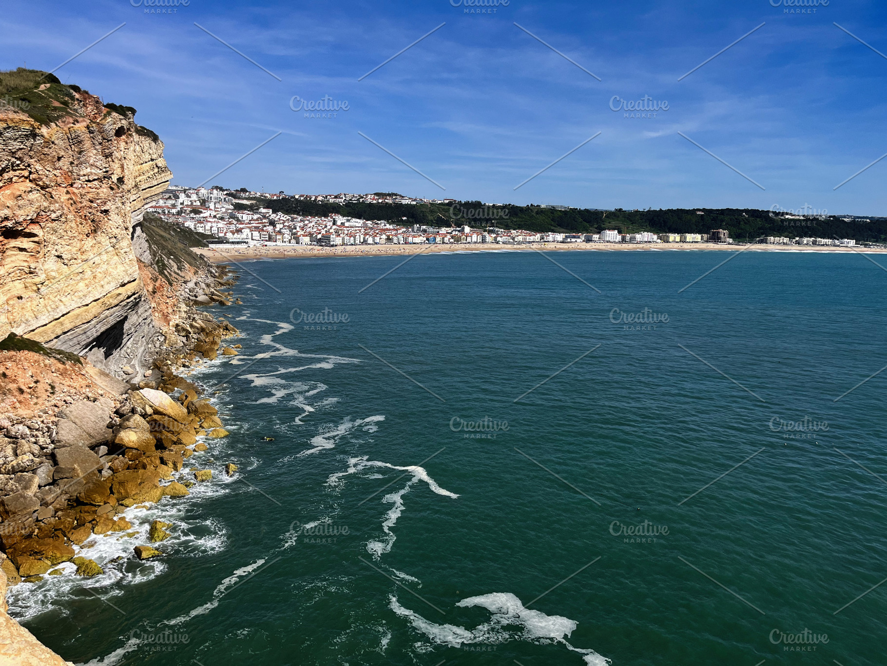 Scenic coastal view of Nazaré with cliffs, ocean, and sunny skies, a Photo by AS photostudio