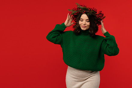 Woman wearing festive wreath of red