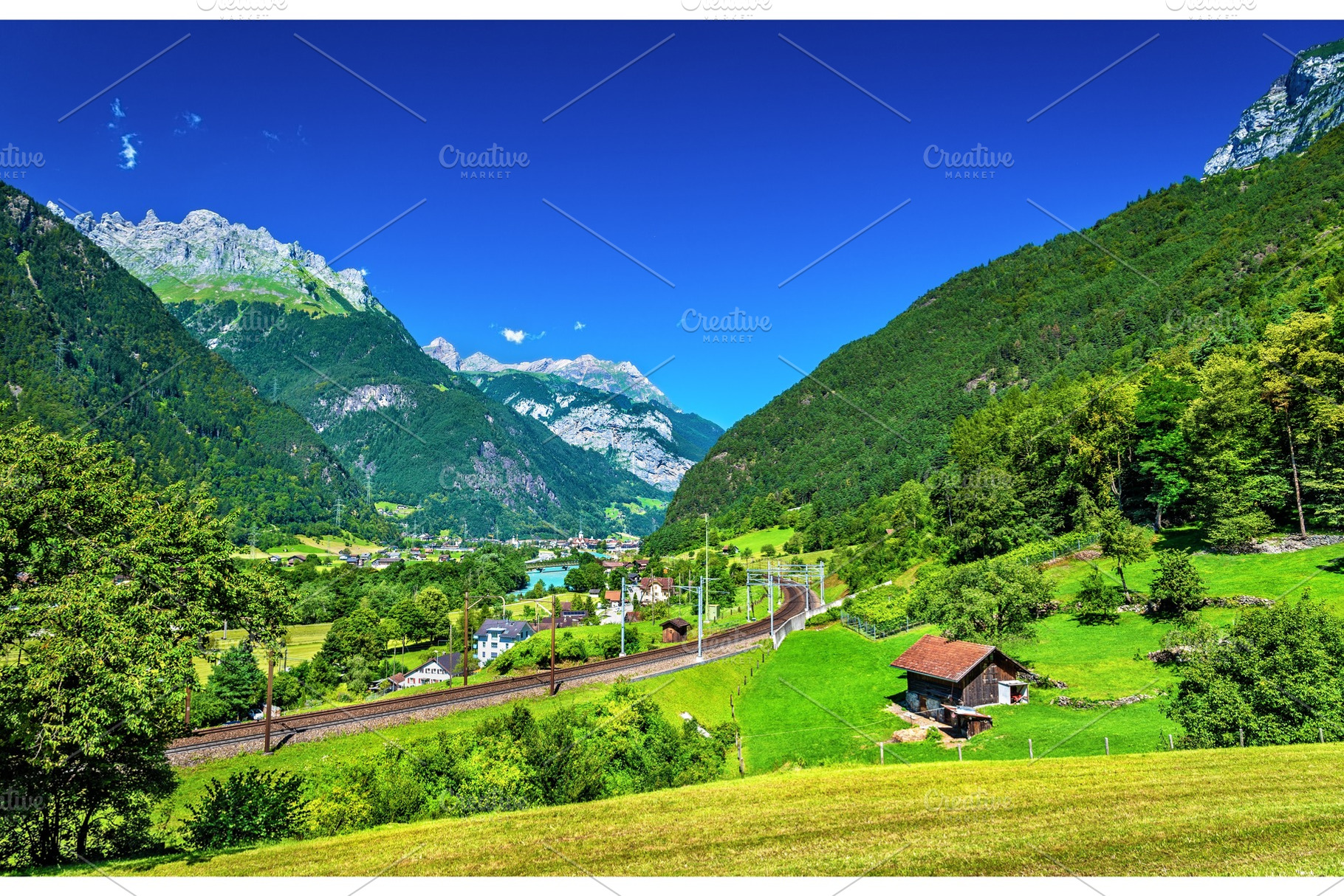 View of erstfeld a village in swiss alps containing mountain, switzerland, a Transportation Photo by Leonid Andronov