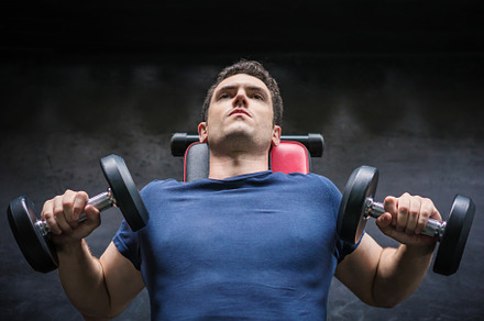 Handsome weightlifter lifting bench press working out with dumbb, a Sports & Recreation Photo by Casanowe-studio