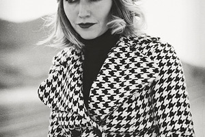 Model beauty portrait containing hat, coat, and diamond coat