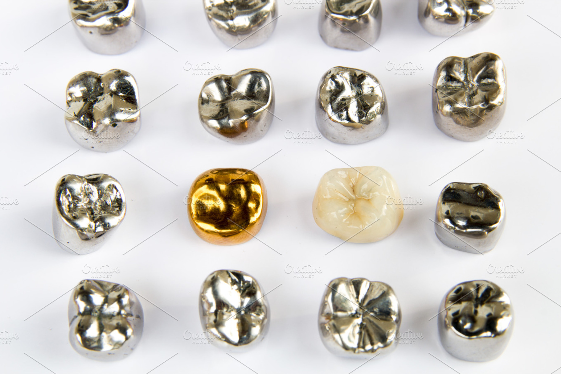 Dental ceramic gold and metal tooth crowns on white background isolated stock, a Health & Medical Photo by Life For Photo