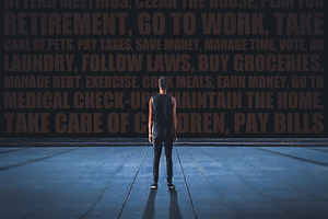 Man standing before a wall of words representing modern obligati, a Health & Medical Photo by DanFLCreativo