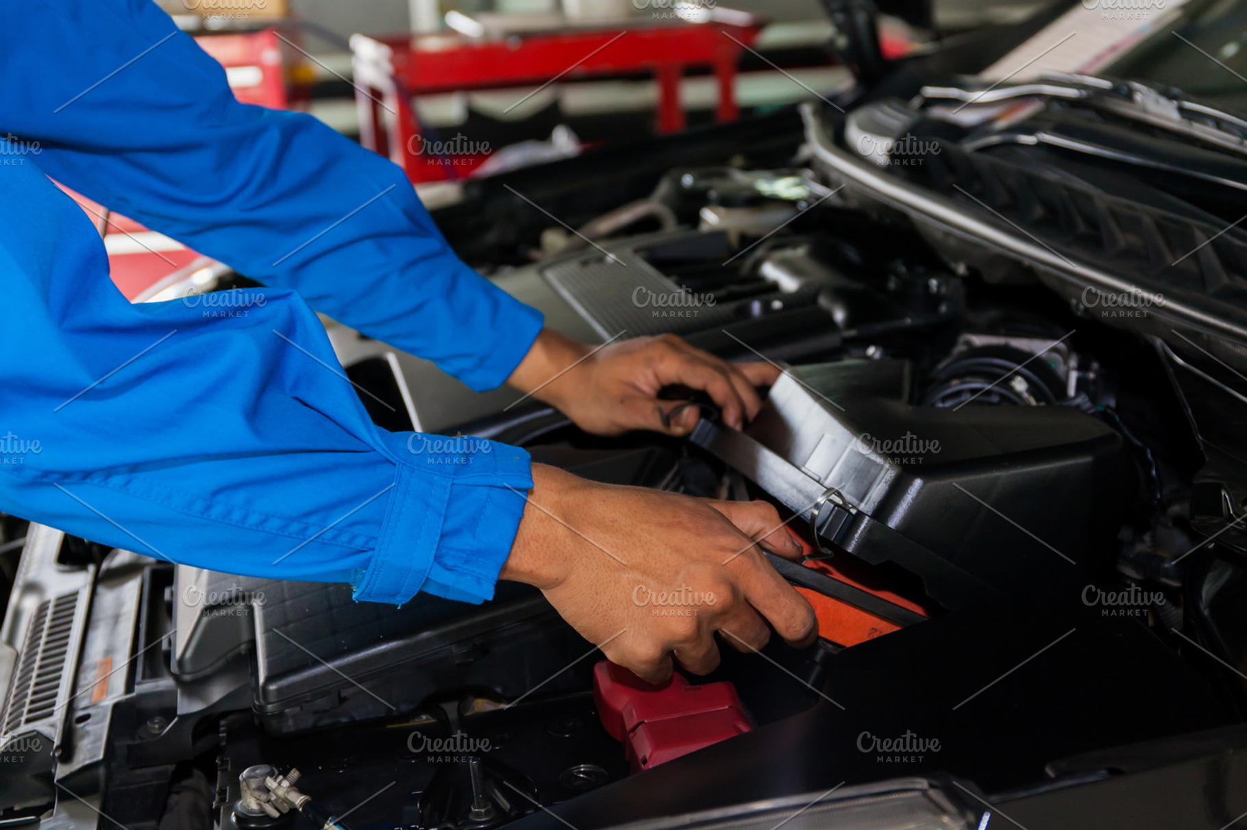 Mechanic fixing a broken car, an Industrial Photo by Twinster Photo