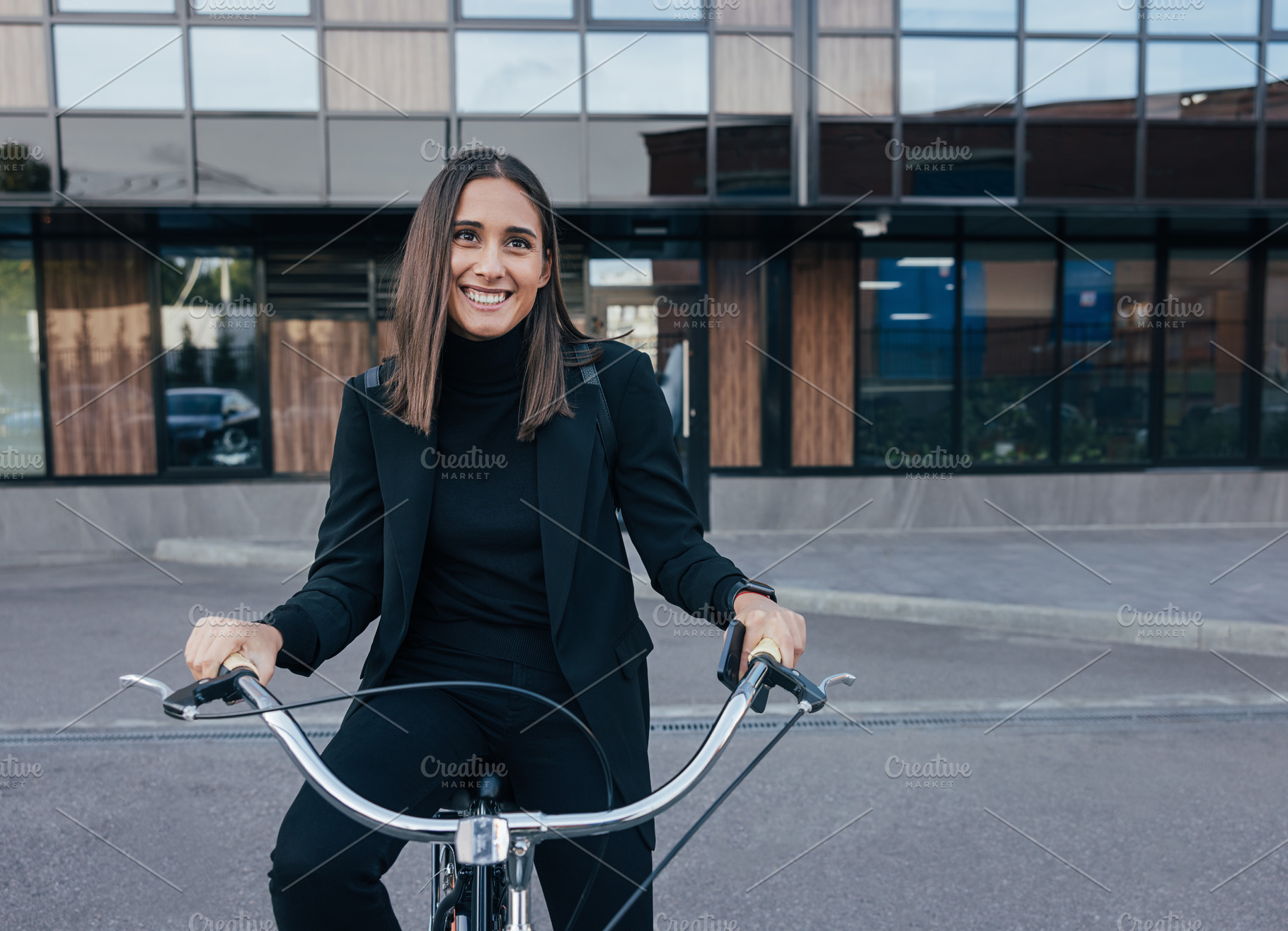 Young cheerful female in black, a Business Photo by Artem Varnitsin