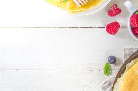 Crepes pancakes with berries, a Background Photo by Rimma