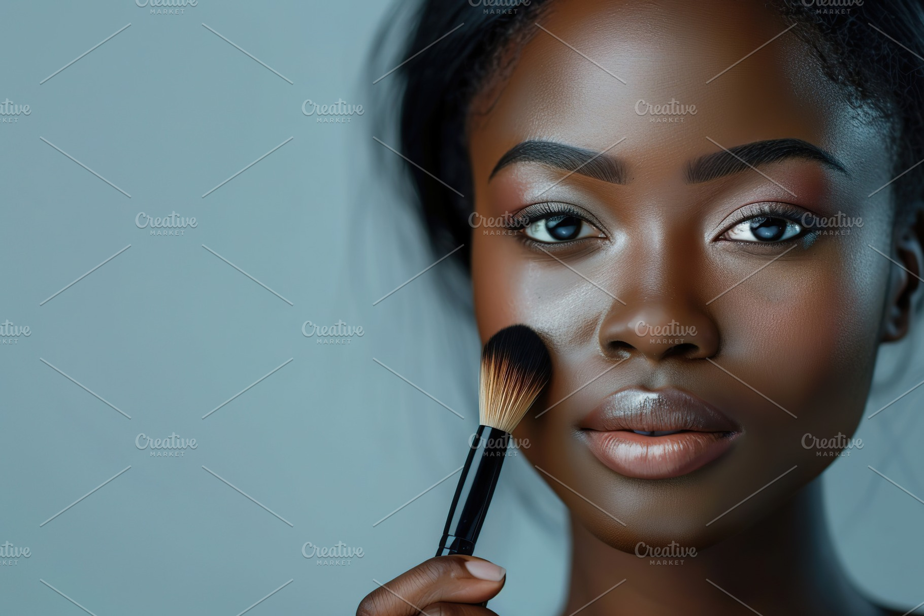 Portrait of african american woman with clean healthy skin holding cosmetic bru, a Beauty & Fashion Photo by AlyaAnd