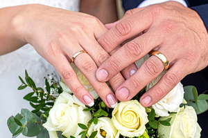 Wedding Rings on Couple Hands with White Roses, a Person Photo by Davizro's Market