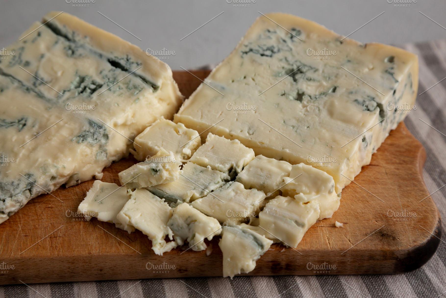 Blue cheese Gorgonzola on a Wooden Board, side view. Close-up., a Food & Drink Photo by LiudmylaChuhunova