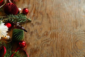 Rustic Christmas border with paper ornaments, vintage glass fini, a Photo by Sonjachni