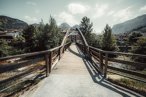 Wooden bridge in mountain village, an Architecture Photo by SkyNext