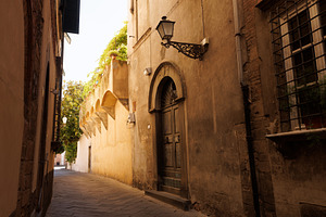 A picturesque narrow alley or street in the historic center of Lucca, an Architecture Photo by Bepslabor