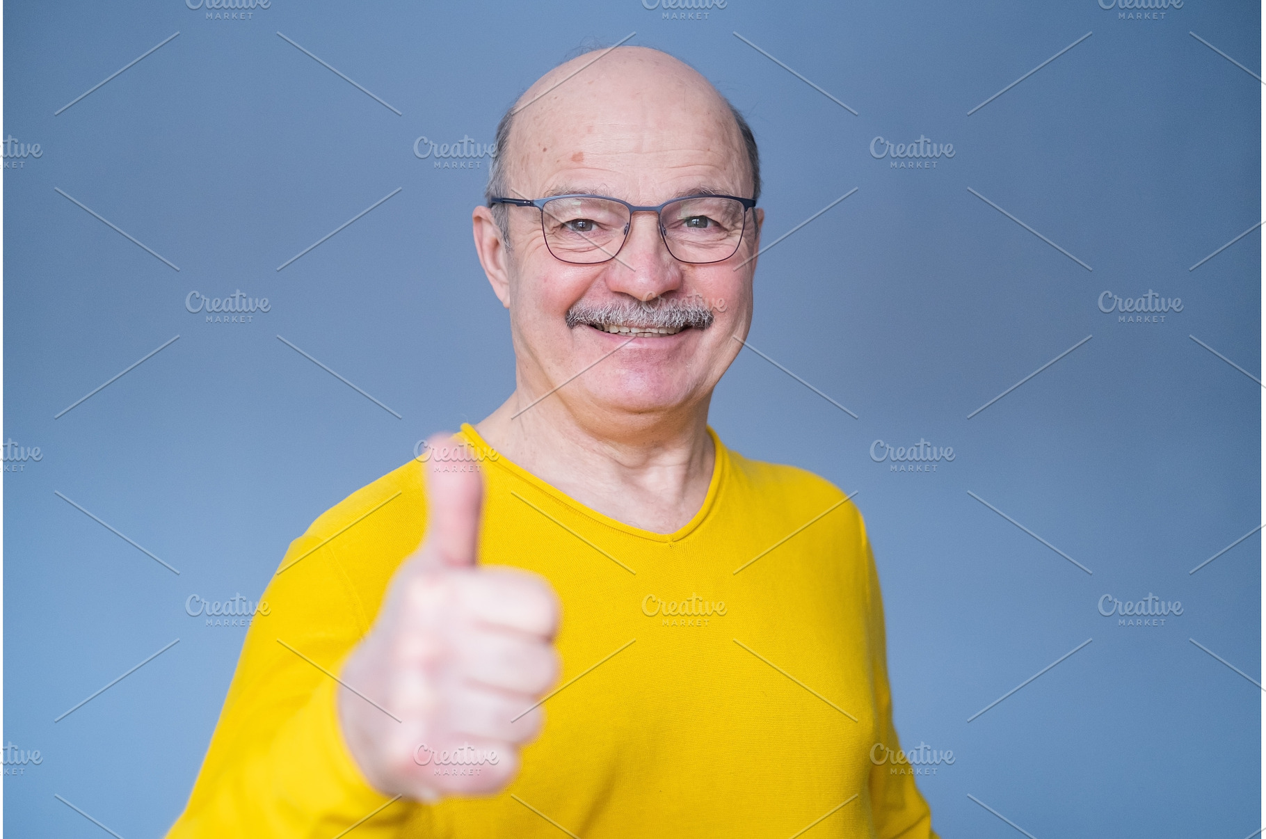 Senior man thumbs up isolated over, a Person Photo by Koldunov