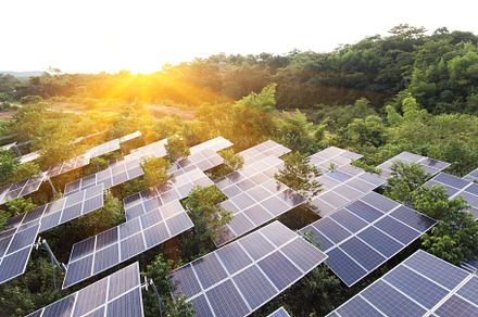 Sunset over solar farm containing energy, clean, and solar