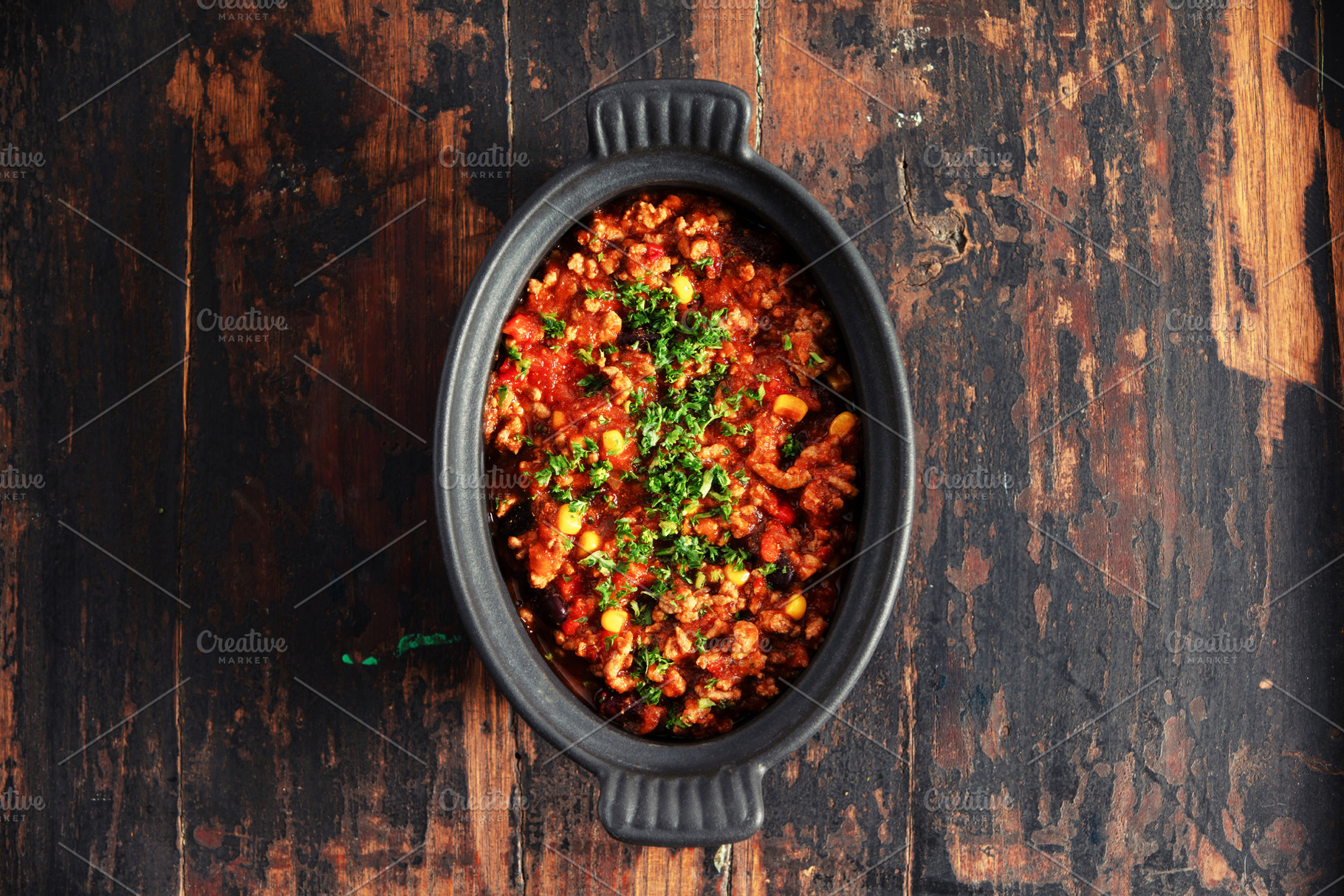Traditional Mexican Beef Chili Con Carne in Black Dish on Rustic, a Food & Drink Photo by Natalia Klenova's Shop