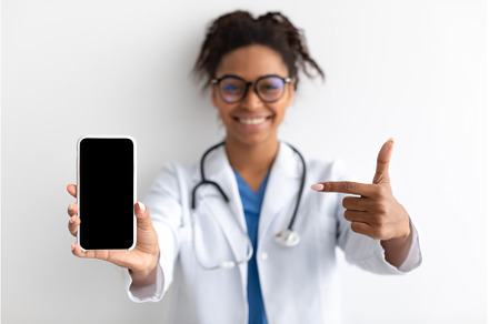 Doctor pointing at big white empty, a Person Photo by Prostock-Studio