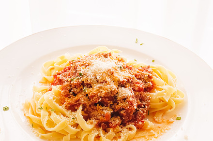 Pasta with bolognese sauce and parmesan cheese, homemade food an, a Food & Drink Photo by Anneleven