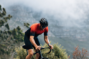 Cyclist on road bike riding, a Sports & Recreation Photo by Artem Varnitsin