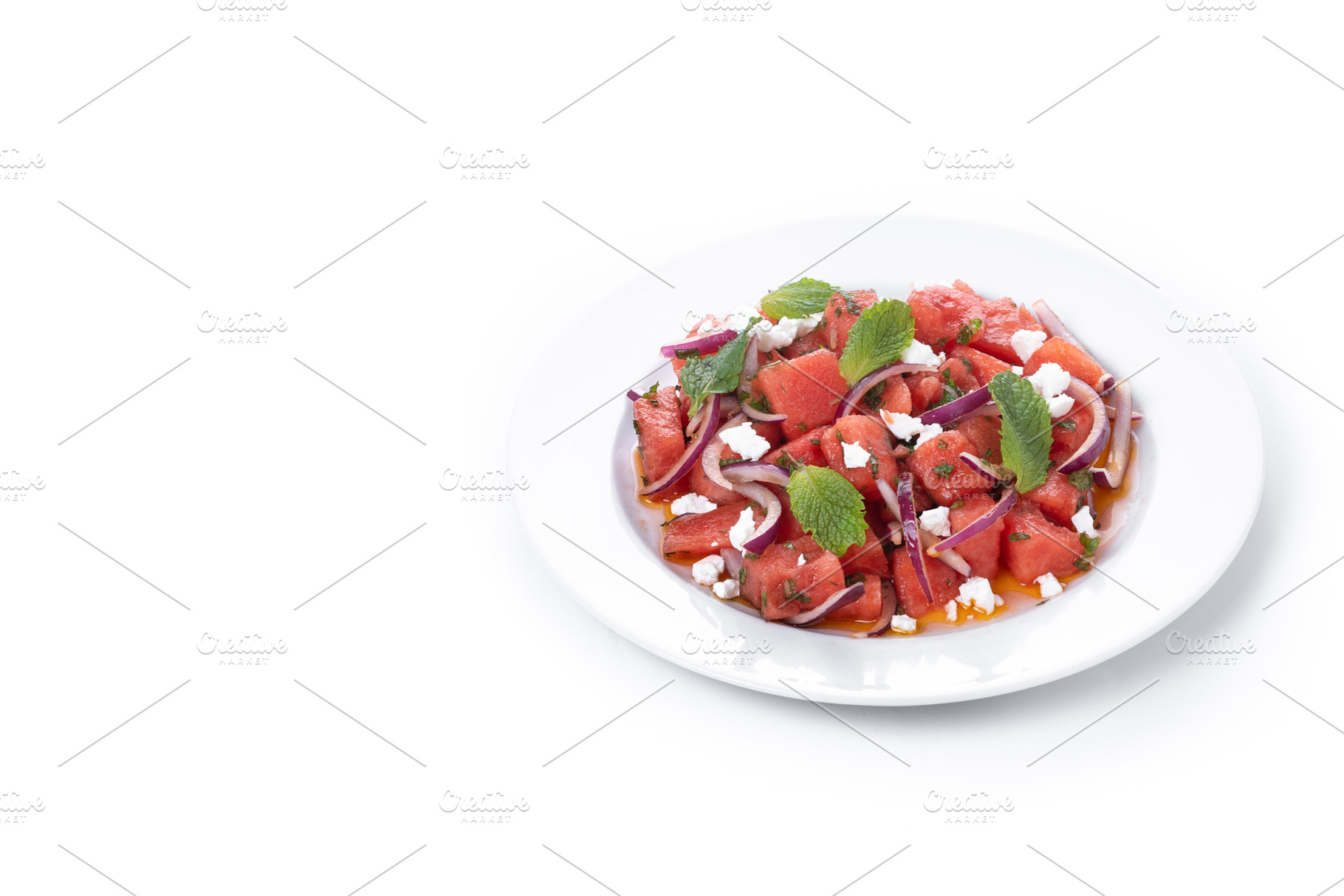 Fresh Watermelon Feta Salad with Mint and Red Onion isolated on white backgroun, a Food & Drink Photo by etorres69