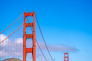 Golden Gate Bridge over blue waters with scenic hills in San Fra, an Architecture Photo by GoodGoods