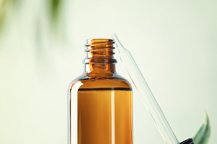 Blank transparent amber glass essential oil bottle and pipette o, a Beauty & Fashion Photo by Natalia Klenova's Shop