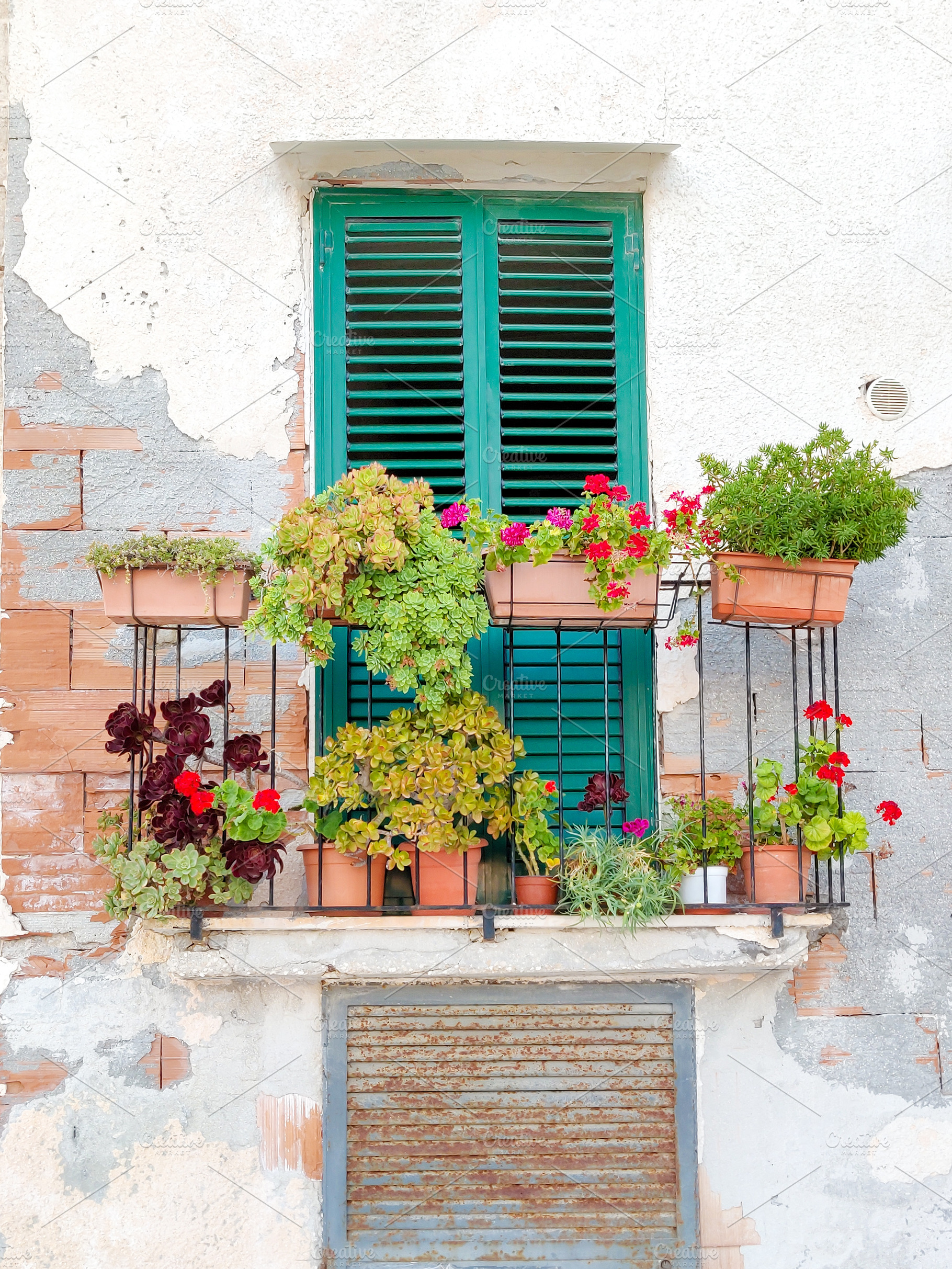 Balcony with flowers on rustic wall, an Architecture Photo by Irina Moskalev