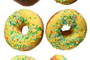 Yellow glazed donuts, each decorated with multi colored sprinkle, a Food & Drink Photo by ndanko