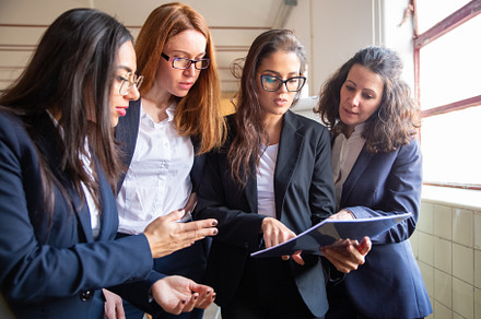Concentrated business team reading