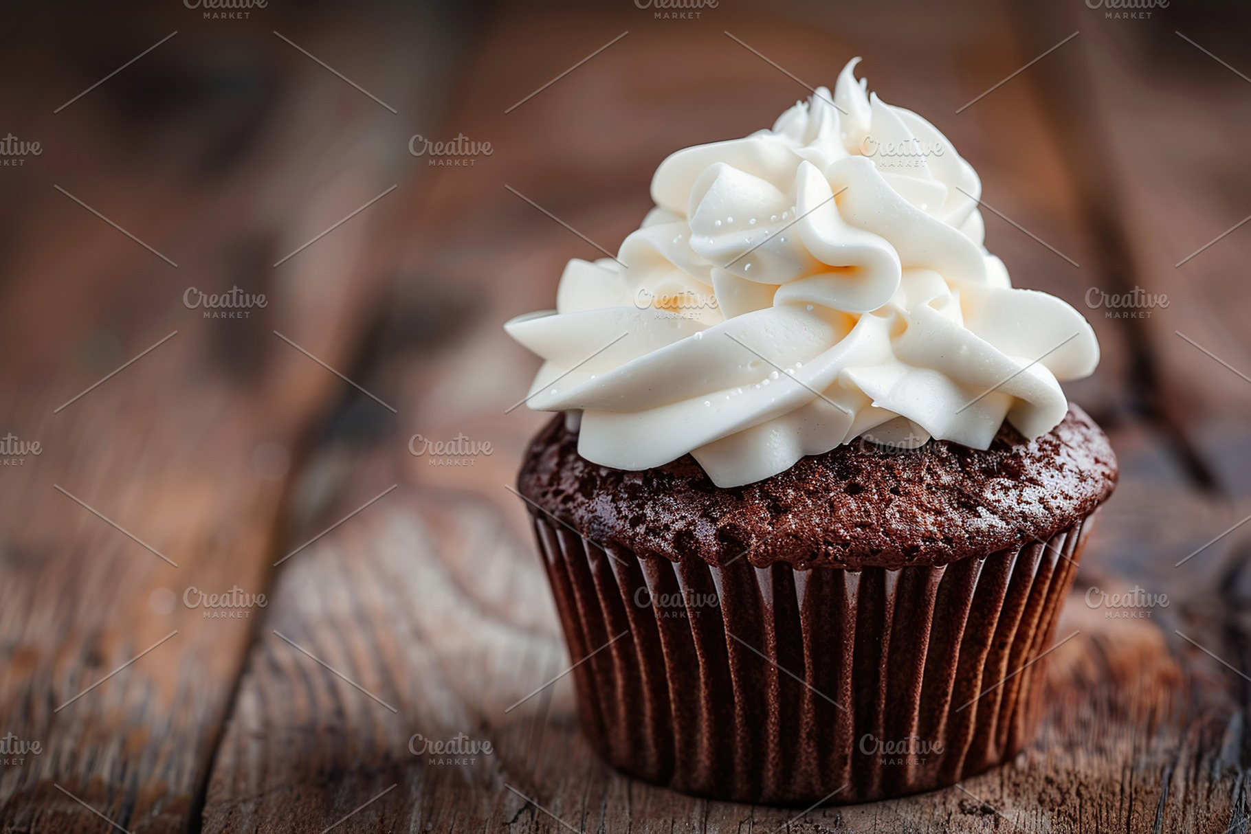 Chocolate cupcakes with white whipped cream on wooden table, a Food & Drink Photo by AlyaAnd