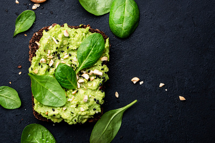 Avocado toast with rye bread with spinach, crushed cashew nuts a, a Food & Drink Photo by 5PH